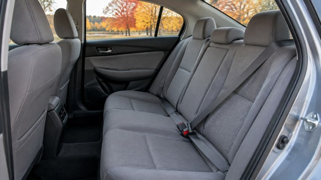 Bedford 10.13.26 Photo for used car seat belts in Bedford OH: gray seat belt buckled across an empty rear seat