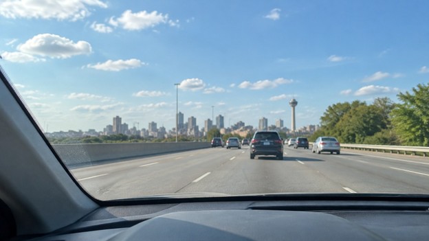 Midtown 10.13.26 Photo for used car windshield in San Antonio TX: view through a clean windshield on a sunny San Antonio highway