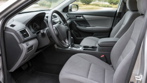 Photo for used car inspection in Rogers AR: clean car interior seen through an open driver door